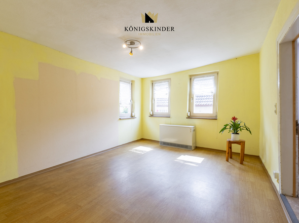 1.OG Wohnzimmer- Wärme und Gemütlichkeit: Das Herzstück des Hauses 