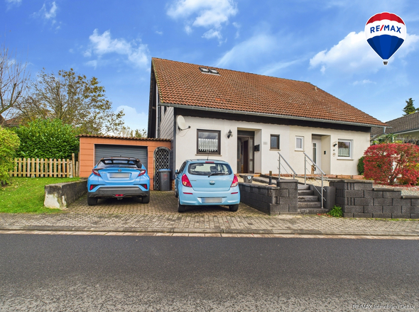 RE/MAX Immobilien DeLux Einfamilienhaus Niederlosheim Außenansicht