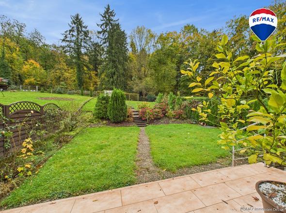 RE/MAX Immobilien DeLux Einfamilienhaus Körprich Gartenansicht