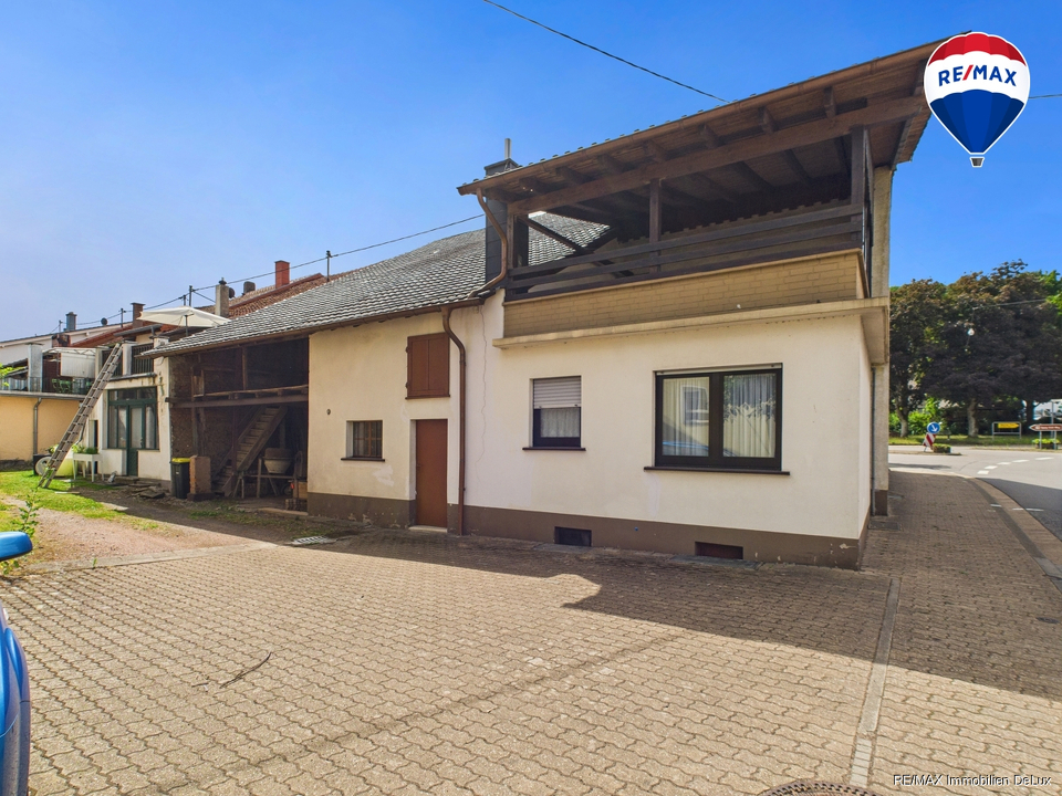 RE/MAX Immobilien DeLux Haus in Losheim am See/ Bachem 