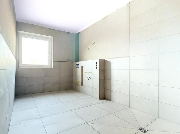 Badezimmer mit bodengleicher Dusche