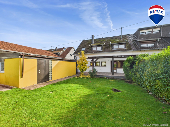 RE/MAX Immobilien DeLux Soppelhaushälfte Mettlach Garten