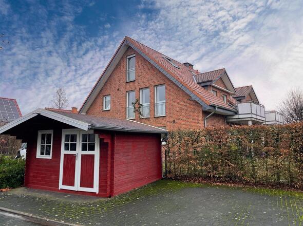 mit Gemeinschaftsfahrradabstellhaus