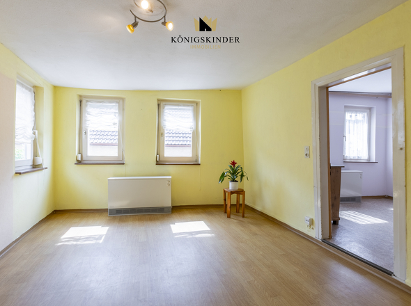 1.OG Wohnzimmer- Wärme und Gemütlichkeit: Das Herzstück des Hauses 