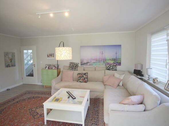 Herzstück Wohnzimmer EG als Dreh- und Angelpunkt